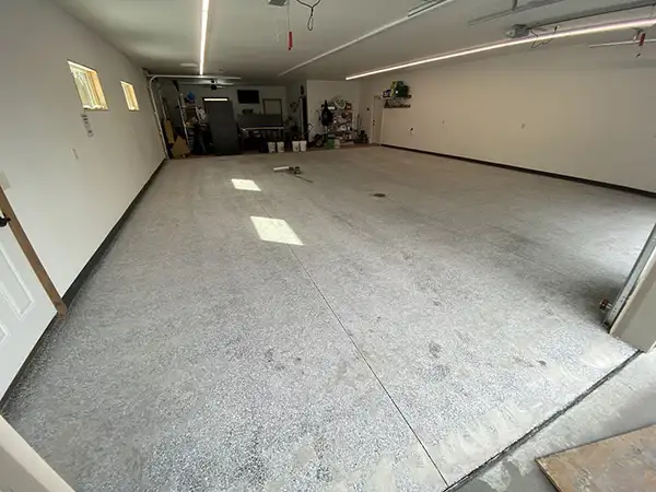 Bare concrete garage floor before coating